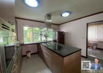 Modern kitchen with island and large window