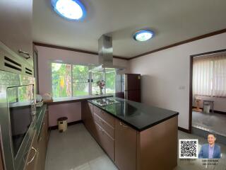 Modern kitchen with island and large window