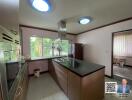 Modern kitchen with island and large window