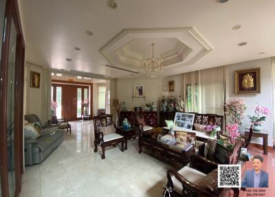 Spacious and elegantly decorated living room with furniture and decor