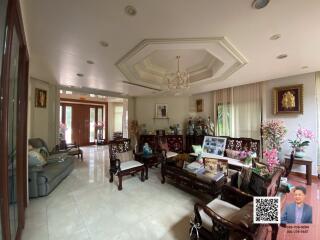 Spacious and elegantly decorated living room with furniture and decor