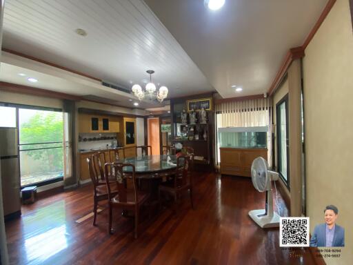 Spacious dining area with wooden flooring and large windows