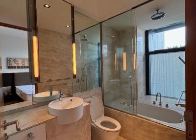 Modern bathroom with glass shower and bathtub