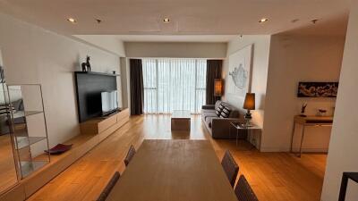 Modern living room with dining area and large window