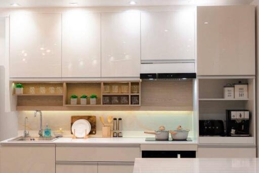 Modern kitchen with white cabinets and appliances