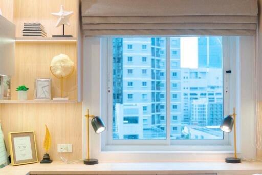 Window view in a well-lit bedroom with desk