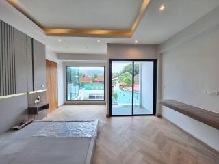 Modern living room with large windows and balcony access