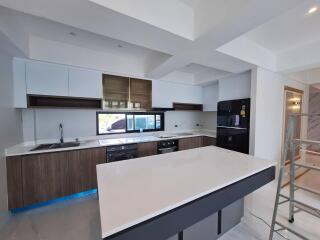 Modern kitchen with island, appliances, and sleek design