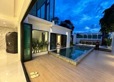 Modern outdoor space with pool and seating area