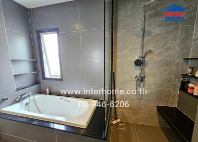 Modern bathroom with bathtub and shower