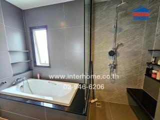 Modern bathroom with bathtub and shower