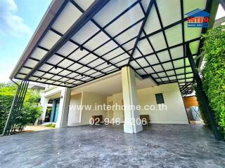 Exterior view of a modern house with a covered carport