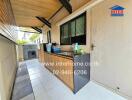 Outdoor kitchen area with countertop and cabinets