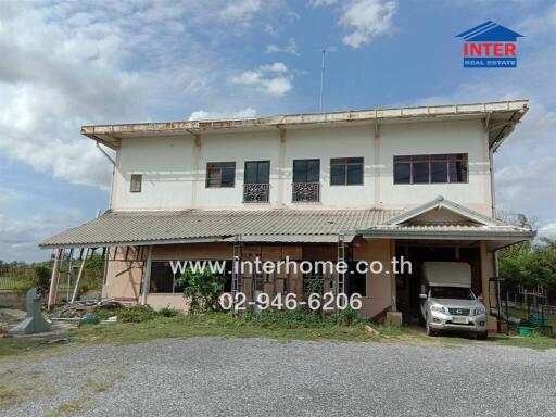 Two-storey residential building with parking space