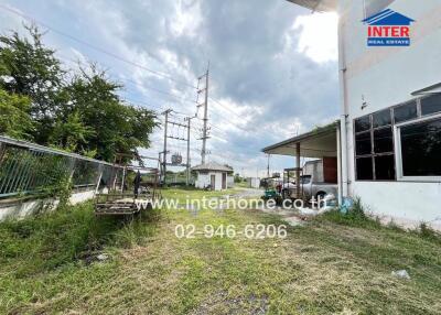 Backyard or outdoor area with grassy space