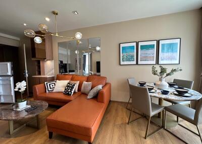 Living room with modern decor and dining area