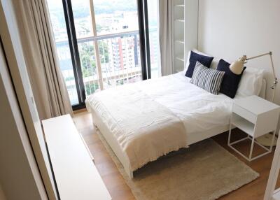 Bright bedroom with balcony view