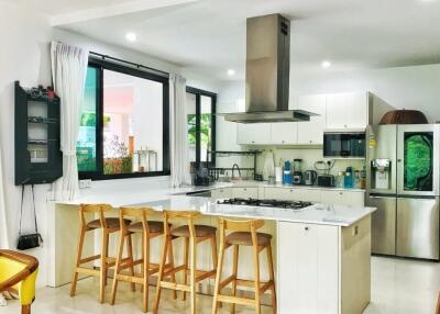 Modern kitchen with island and bar stools