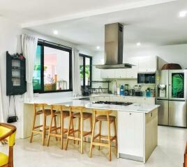 Modern kitchen with island and bar stools