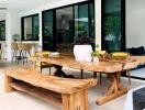 Outdoor dining space with wooden table and benches