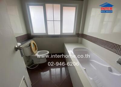 Bathroom with bathtub and toilet