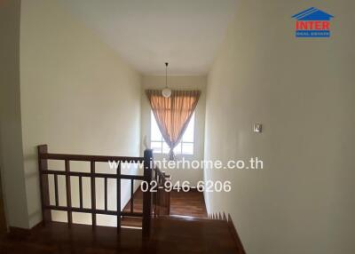 Spacious hallway with natural light from window