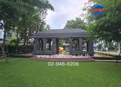 Outdoors with gazebo and greenery