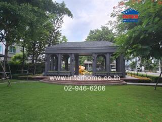 Outdoors with gazebo and greenery