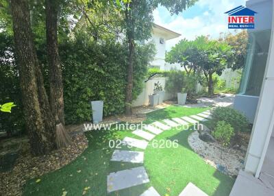 Beautifully landscaped garden with stepping stones