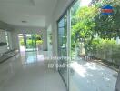 Bright living area with large windows and garden view