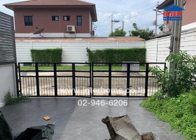 Gated outdoor area with driveway