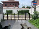 Gated outdoor area with driveway