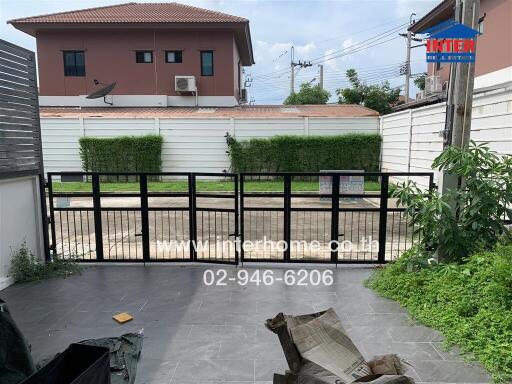 Gated outdoor area with driveway