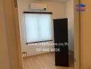 Small bedroom with window and air conditioner