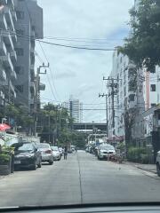 Street view with buildings and parked cars