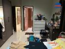 Bedroom with furniture and open closet door