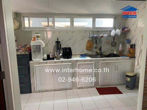 Simple kitchen with appliances and storage