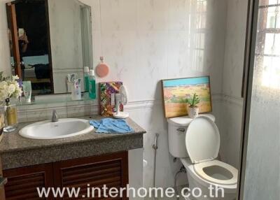 Bathroom with sink and toilet