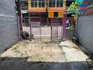 front yard with gate and paved flooring