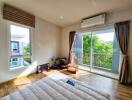 Bedroom with air conditioning and balcony