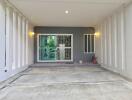 Covered garage or carport with sliding glass door and lights