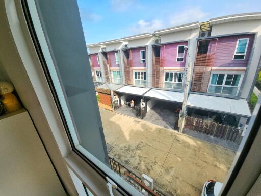 View from window showing residential townhouses