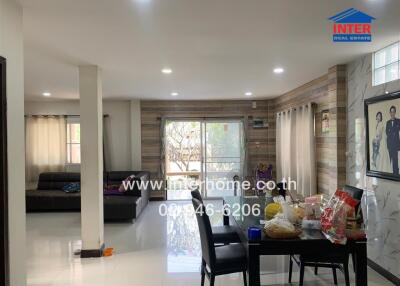 Spacious living room and dining area with natural light