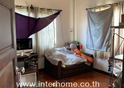 Bedroom with natural light and hardwood floors