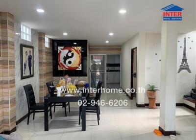 Modern dining room with decor and kitchen view