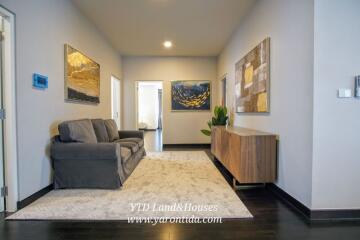 Modern living room with wall art and furniture