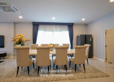 Elegant dining area with large table and comfortable chairs