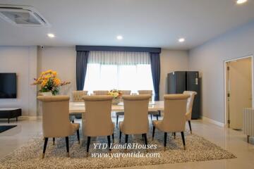 Elegant dining area with large table and comfortable chairs