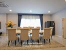 Elegant dining area with large table and comfortable chairs