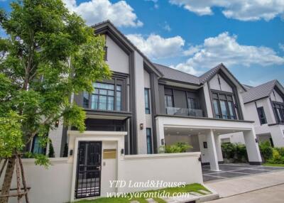 Modern two-story house with a landscaped front yard